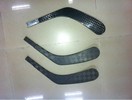 Composite, plastic hockey sticks